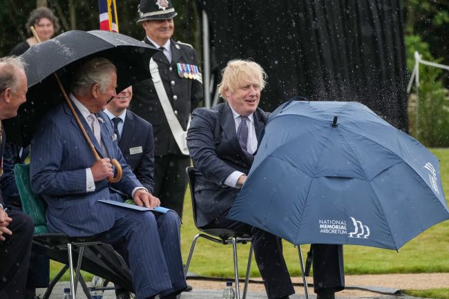 Prince Charles Keeps his Cool as Boris Johnson Struggles with Umbrella