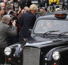 Elizabeth Debicki Sports Princess Diana's Signature Locks As She Pushes Her Way Through The Paparazzi To Talk To A Taxi Driver While Filming New Scenes For Series Five Of The Crown In Croydon