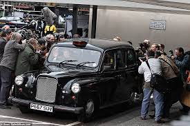 Elizabeth Debicki Sports Princess Diana's Signature Locks As She Pushes Her Way Through The Paparazzi To Talk To A Taxi Driver While Filming New Scenes For Series Five Of The Crown In Croydon