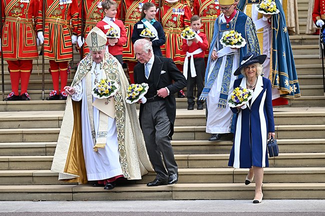 The Duchess looked elegant in a navy and white coat dress