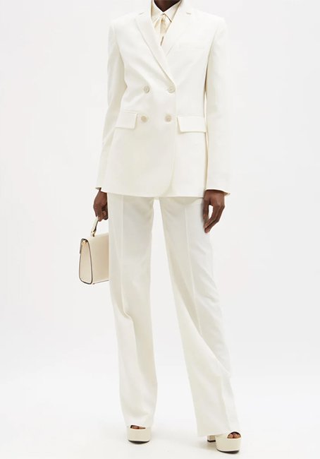 Valentino double-breasted wool-twill blazer, £2,100/$3,500, and matching pintucked wool tailored trousers, £1,100/$1,900, Matches Fashion