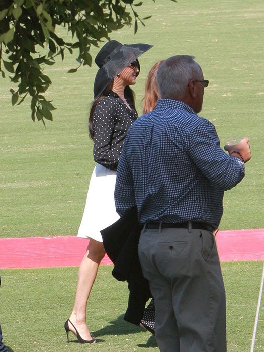 Meghan Markle looked stunning in a white skirt and polka dot blouse
