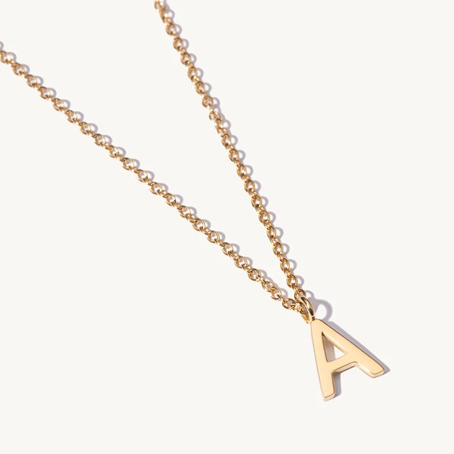 SHOP SIMILAR: Initial necklace, £45, D.Louise Jewellery