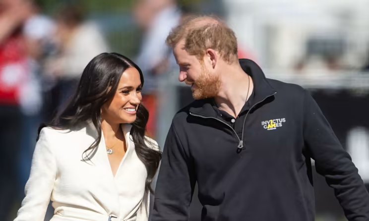rare-sighting-of-archie-on-prince-harry-985930803.png