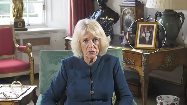 The frame behind Camilla shows the heartwarming photo