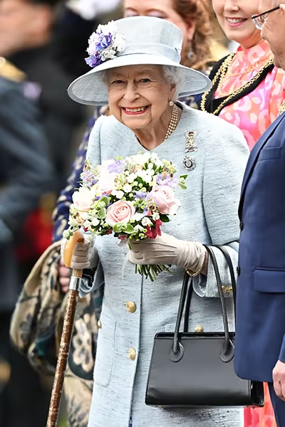 The Queen was pictured using her walking stick at the event