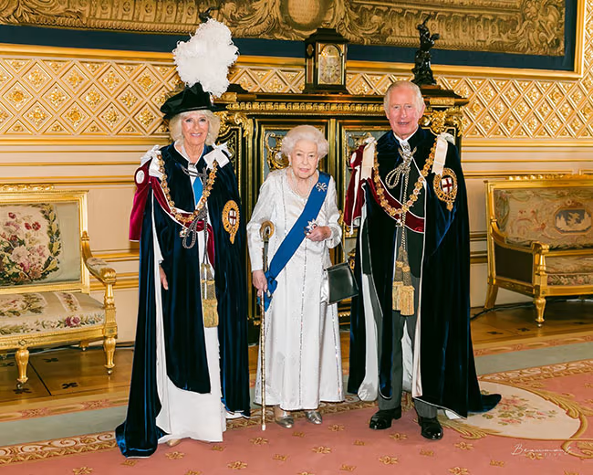 The Queen, Prince Charles and the Duchess of Cornwall pictured inside the Throne Room