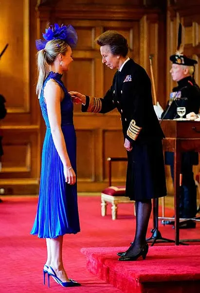 Princess Anne presents Victoria Drummond with her MBE