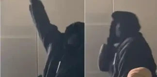 Kanye West and wife completely cover their faces at fashion show (video)