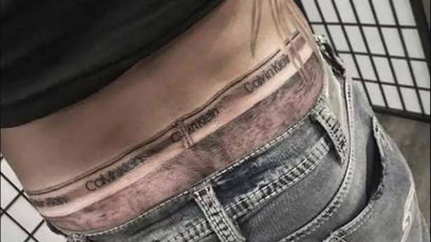 Man gets Calvin Klein boxers tattooed so it always looks like he's wearing a pair 12
