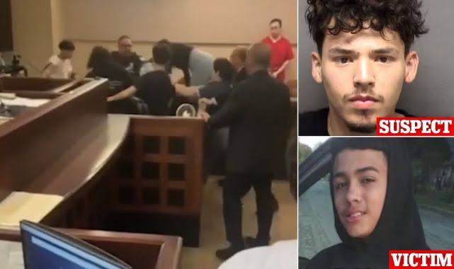 Shocking-moment-handcuffed-murder-suspect-18-is-beaten-up-by-family-of-his-victim-15-in-COURT-098-