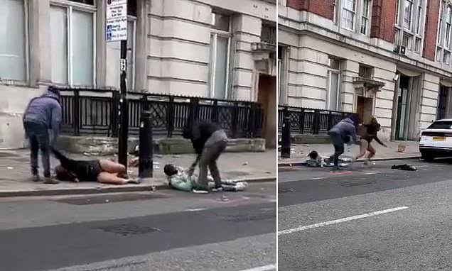 Two-people-sprawled-on-the-floor-AFTER-being-mugged-by-thugs-near-London-Euston-station