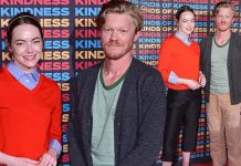 Emma Stone looks chic in a red jumper with co-star Jesse Plemons at the Kinds Of Kindness screening in London