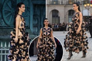 Katy Perry, 39, goes BRALESS in a revealing geometric cut-out dress on