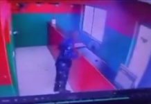 Man in police uniform SEEN on CCTV stealing from a store (video)
