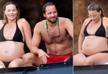 Margot Robbie showcases her growing baby bump WHILE relaxing with husband Tom Ackerley