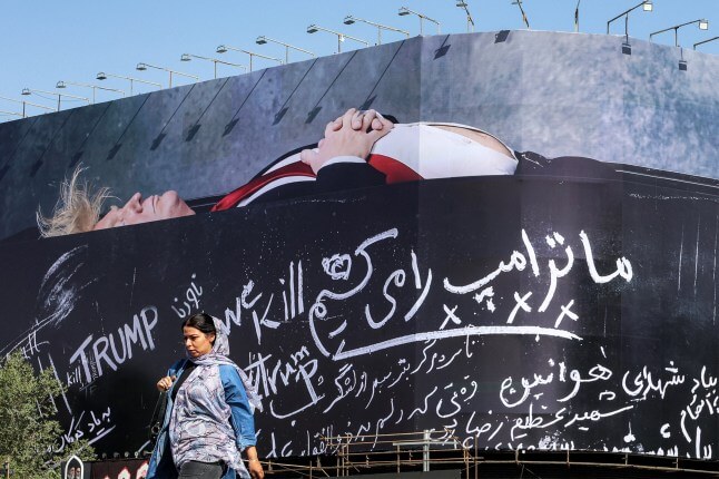 Iran UNVEILS huge billboard of Donald Trump in a coffin saying 'we will kill' him (1)