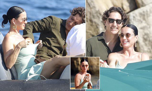 _Katy Perry and Justin Trudeau in a public racy display as he applies sunscreen DOWN her top and bust 82726262