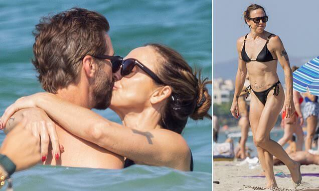 Mel C and new husband Chris Dingwall passionately kiss one another during honeymoon in Ibiza (1)