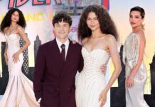 Zendaya stuns in a plunging white gown as husband Tom Holland SWOONS over her at Spider-Man premiere