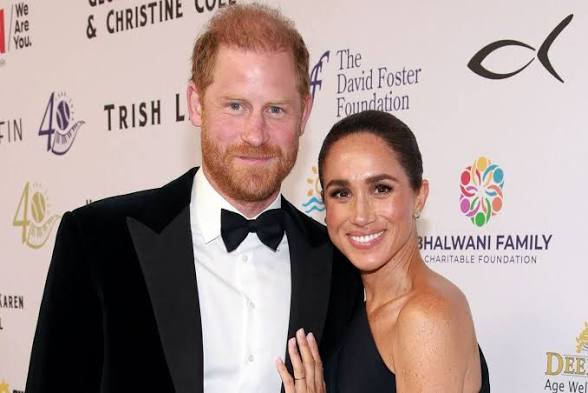 Meghan WEARS Princess Diana's earrings as she steps out with Prince Harry for a red carpet date night 61514111