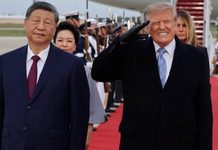 Trump WINCES and flinches during Xi’s red carpet welcome – the same treatment he mocked Obama for